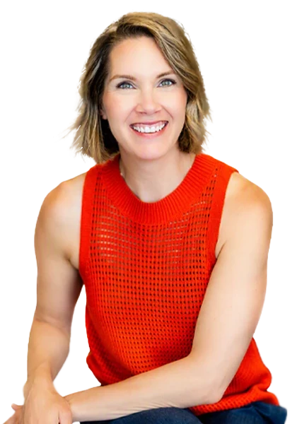 Studio portrait of Dr. Sara Stefan wearing a sleeveless orange top, seated against a transparent background.